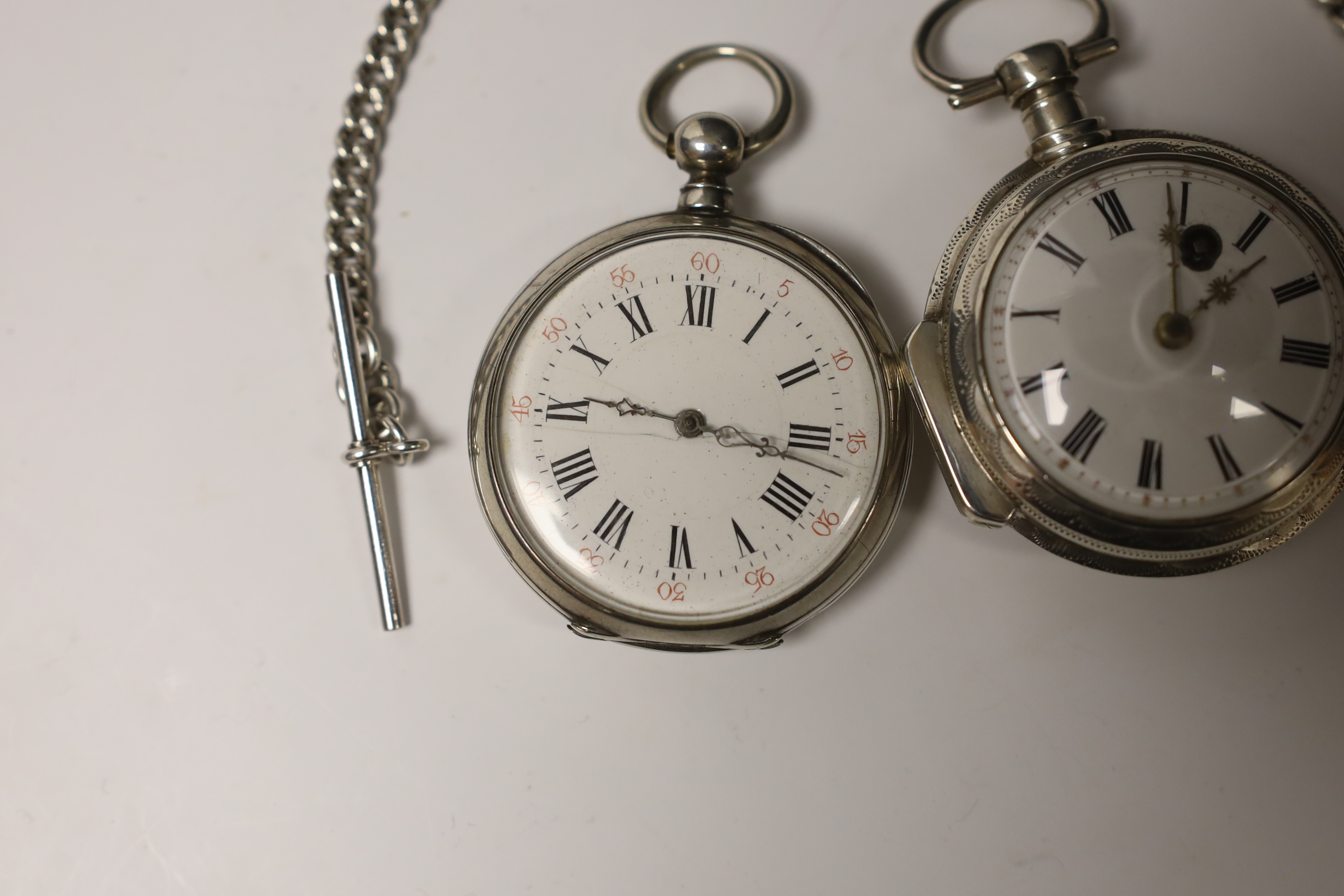 A continental white metal keywind open face pocket watch, with Roman dial, case diameter 46mm, together with French white metal open face keywind pocket watch and a silver albert.